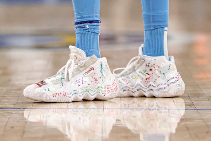 Candace Parker's white Adidas shoes.